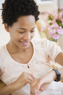 African American woman checking the time