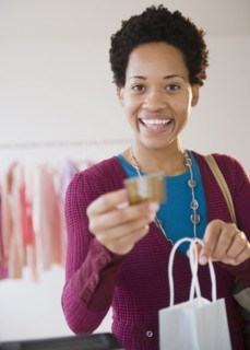 African American woman shopping with credit card