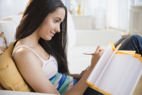 Hispanic teenager doing homework
