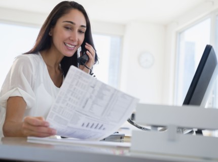 Caucasian businesswoman working at desk