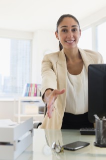 Caucasian businesswoman offering handshake