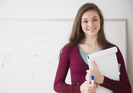 Hispanic girl holding notepad