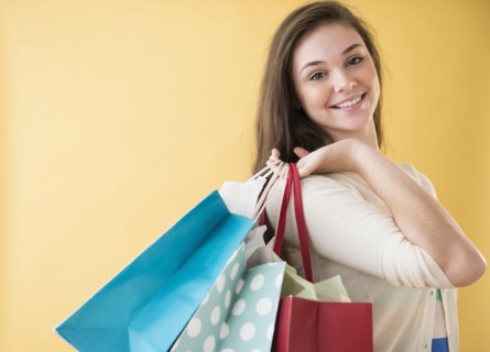 Hispanic girl carrying shopping bags