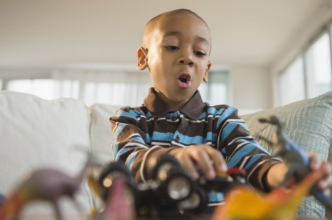 African American boy playing with toys