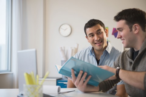 Businessmen talking in office
