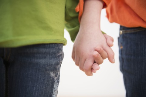 Close up of girls holding hands