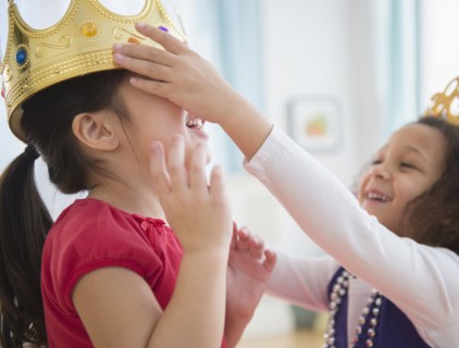 Girls playing dress up together