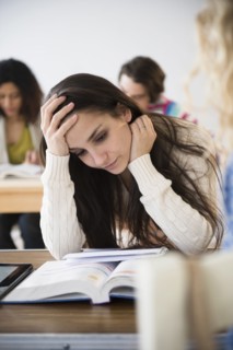 Student reading in class
