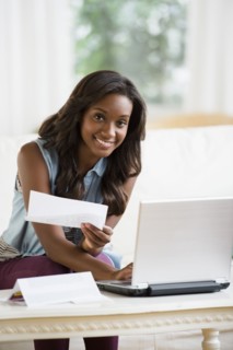 Black woman paying bills online