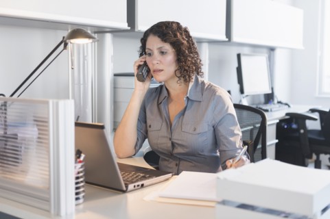 Hispanic businesswoman working in office