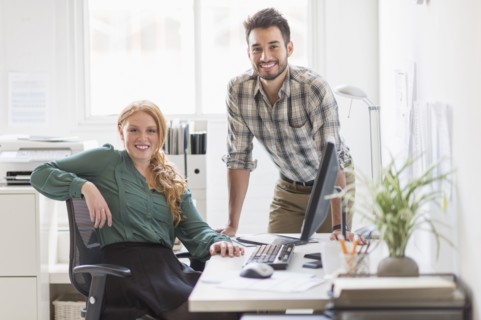 Business people smiling together in office
