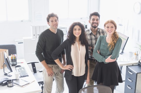 Business people smiling together in office