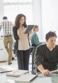 Businesswoman using digital tablet in office