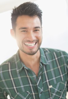 Mixed race man smiling