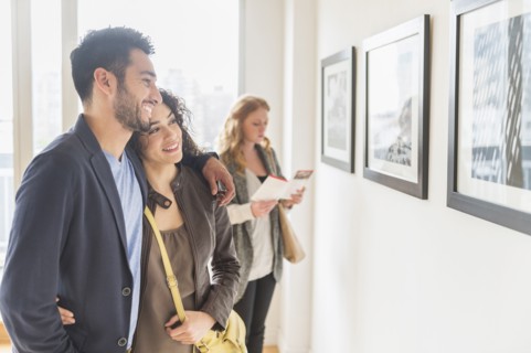 People admiring art in gallery