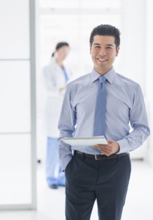 Businessman smiling in hospital