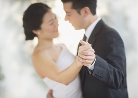 Newlywed couple dancing at wedding reception