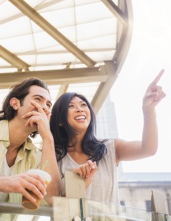 Couple pointing and looking up