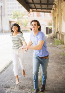 Couple running on urban street