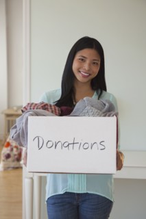 Chinese woman holding donations box
