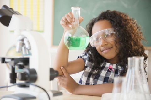 Mixed race student working in chemistry lab