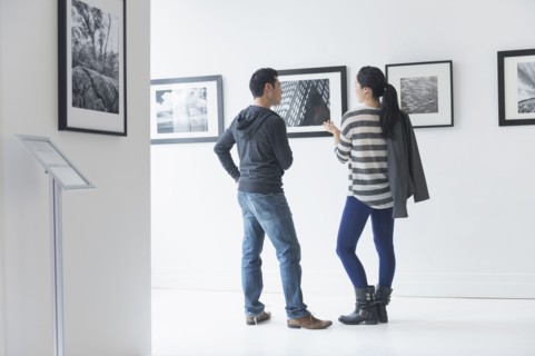 Couple admiring art in gallery