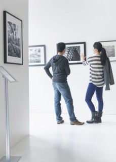 Couple admiring art in gallery