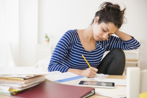 Asian student studying at table