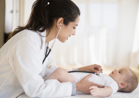 Doctor examining baby