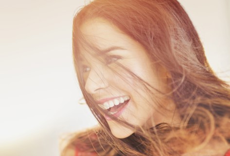 Close up of smiling Hispanic woman