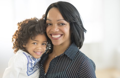 Portrait of smiling African American mother and daughter