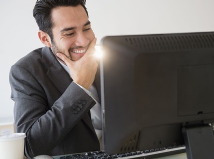 Mixed race businessman working in office