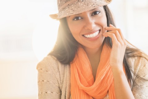 Hispanic woman in fedora and scarf