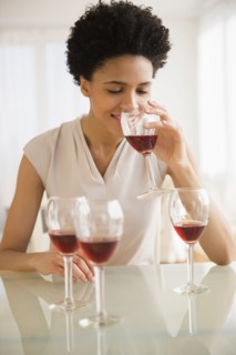 Black woman tasting wine