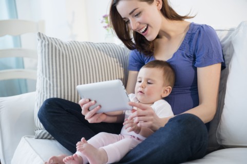 Mother and baby using digital tablet