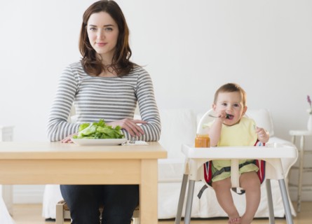Mother and baby eating together