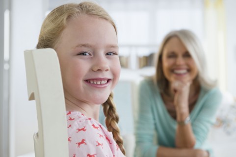 Caucasian girl smiling in chair