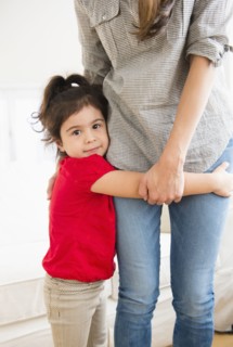 Hispanic girl hugging mother