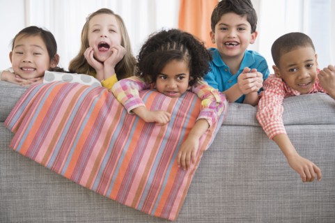 Children playing on sofa