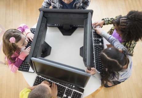 Children using computers in classroom