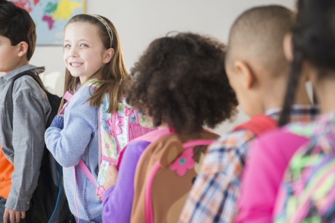 Students standing in line in classroom