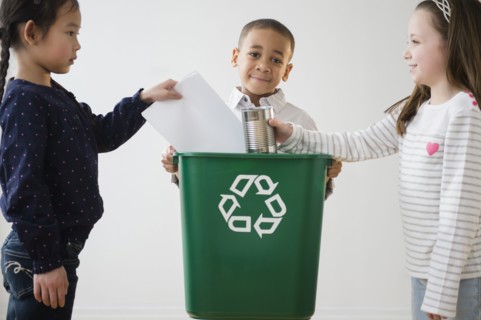 Children recycling together