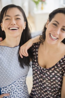 Smiling women standing together