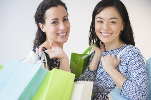 Smiling women shopping together