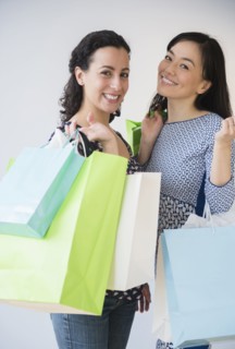 Smiling women shopping together