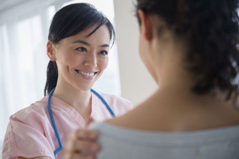 Nurse talking to patient in hospital