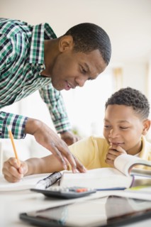 Father helping son with homework