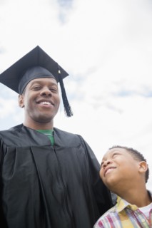 Graduating father smiling with son