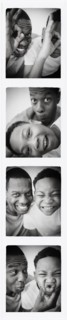 Father and son smiling in photo booth picture