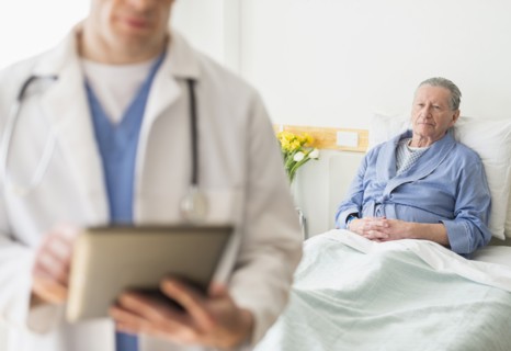 Senior Caucasian man sitting in hospital bed